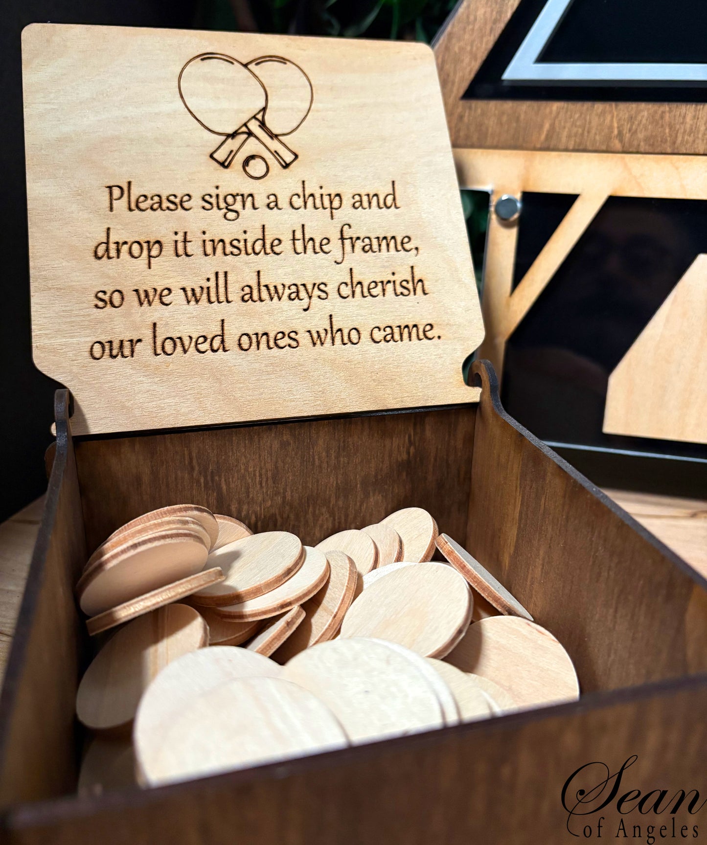 Wooden box with engraved instructions and wooden chips inside.
