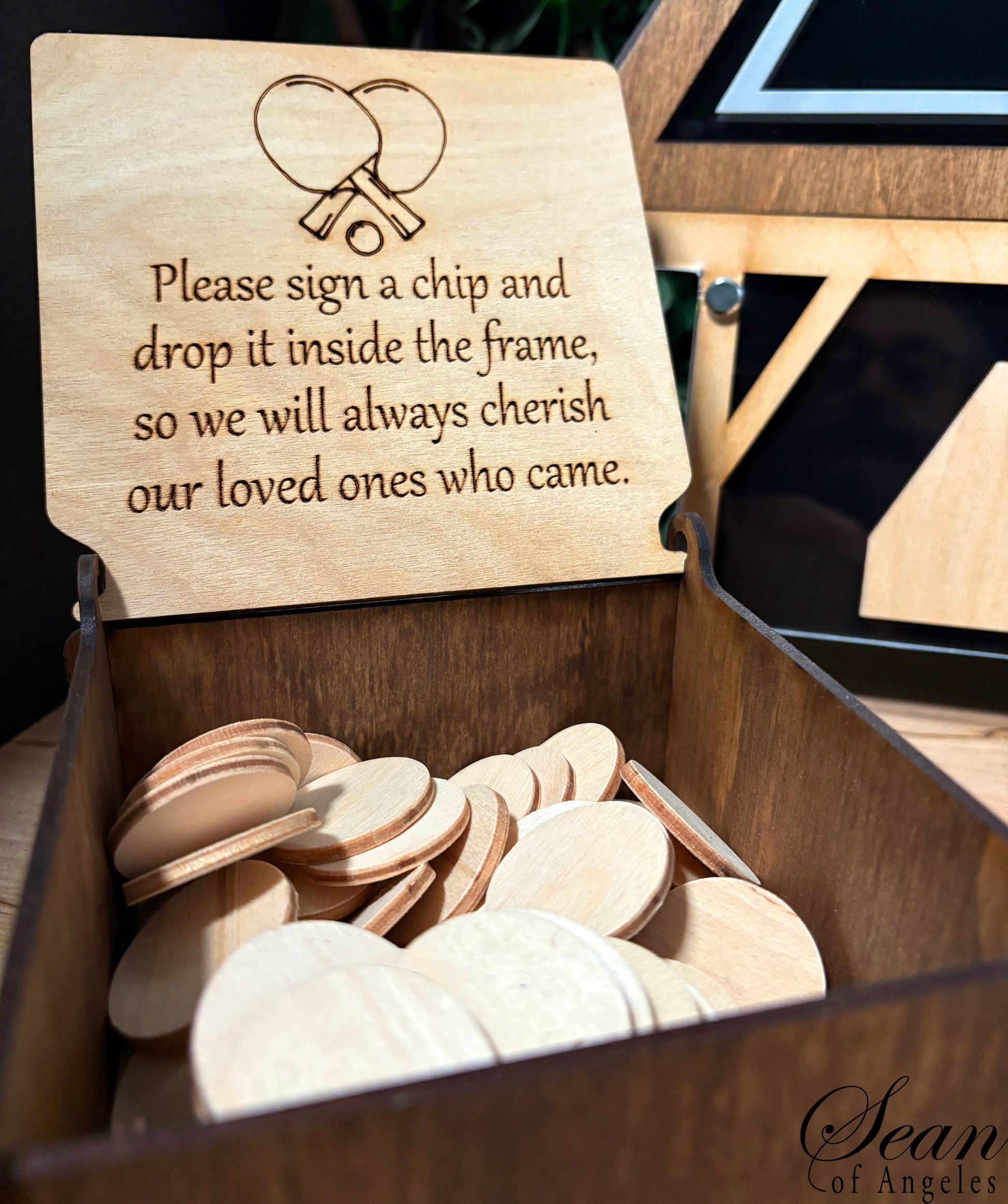Wooden box with engraved instructions and wooden chips inside.